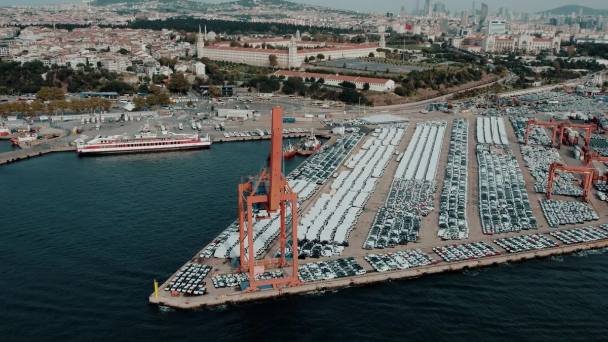 Rows of imported vehicles waiting at a cargo terminal.